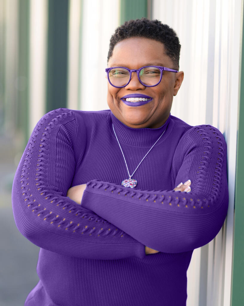 Tia A Williams | Systems Thinking Architect Tia A Williams-Systems Thinking Architect Standing & Smiling